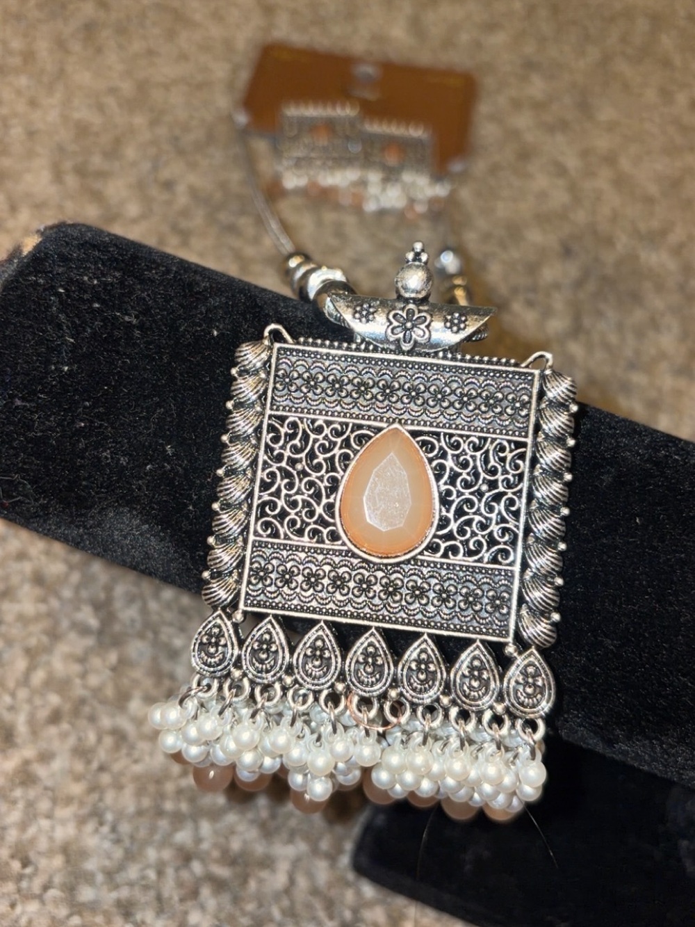 Intricate Silver-Tone Pendant Necklace with Peach Teardrop and Pearl earrings